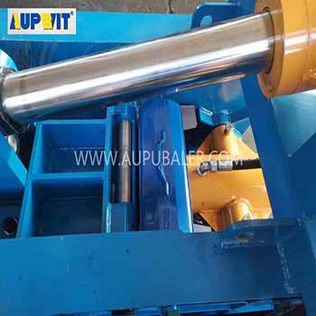 What are the functions of a Scrap Tire Baler Machine